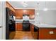 Well-equipped kitchen features granite countertops, stainless steel appliances and wood cabinets at 5057 Lower Elm St, Atlanta, GA 30349