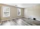 Spacious bedroom with gray wood floors and abundant natural light at 5422 Timor Trl, Lithonia, GA 30038