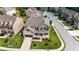 Aerial view of a traditional two-story home with lush green lawn and mature landscaping at 56 Addison Woods Dr, Sugar Hill, GA 30518
