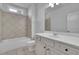 Well-lit bathroom with modern fixtures and a shower-tub combo at 56 Addison Woods Dr, Sugar Hill, GA 30518