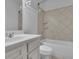 Bathroom with white vanity, tub and tile surround offers a serene and functional space at 56 Addison Woods Dr, Sugar Hill, GA 30518