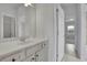 Bright bathroom featuring a vanity with cabinet storage at 56 Addison Woods Dr, Sugar Hill, GA 30518