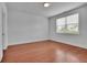 Cozy bedroom with hardwood floors and a bright window at 56 Addison Woods Dr, Sugar Hill, GA 30518