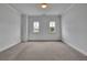 Spacious bedroom with soft carpet and natural lighting at 56 Addison Woods Dr, Sugar Hill, GA 30518