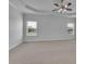 Large bedroom with coffered ceiling, ceiling fan and large windows for a bright atmosphere at 56 Addison Woods Dr, Sugar Hill, GA 30518