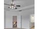 Bedroom with modern ceiling fan and an open doorway to stairs and a bathroom vanity at 56 Addison Woods Dr, Sugar Hill, GA 30518