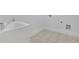 Functional laundry room area with tiled floors and utility sink at 56 Addison Woods Dr, Sugar Hill, GA 30518