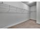Spacious walk-in closet with built-in metal shelving for ample storage at 56 Addison Woods Dr, Sugar Hill, GA 30518