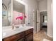 Bathroom boasts a quartz countertop, modern fixtures, and adjoining access to bedroom at 5925 Whitney Ct, Cumming, GA 30041