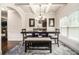 Traditional dining room featuring coffered ceilings, statement chandelier, and dark wood furniture at 5925 Whitney Ct, Cumming, GA 30041