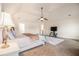 Bright primary bedroom with vaulted ceiling, seating area, and neutral decor at 5925 Whitney Ct, Cumming, GA 30041
