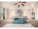 Comfortable primary bedroom features neutral decor, a sitting area, and vaulted ceiling at 5925 Whitney Ct, Cumming, GA 30041