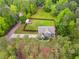 Aerial view of the home surrounded by lush greenery and a well-maintained lawn at 13 Westbrook Rd, Carrollton, GA 30116