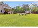 Expansive backyard with lush lawn, patio seating, and a storage shed at 13 Westbrook Rd, Carrollton, GA 30116