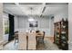 Formal dining room with wainscoting, coffered ceiling, and stylish light fixture at 13 Westbrook Rd, Carrollton, GA 30116