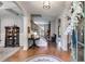 Inviting foyer featuring hardwood floors, elegant staircase, and arched doorways creating a warm and welcoming ambiance at 13 Westbrook Rd, Carrollton, GA 30116