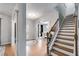 Spacious foyer with hardwood floors, staircase, and view into the dining room at 13 Westbrook Rd, Carrollton, GA 30116