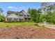 Well-maintained home featuring a sprawling lawn, landscaping, and a classic white picket fence on a sunny day at 13 Westbrook Rd, Carrollton, GA 30116