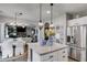Island with seating and stainless steel appliances in this open floor plan kitchen at 13 Westbrook Rd, Carrollton, GA 30116