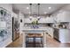 Bright kitchen with stainless steel appliances, granite countertops, and center island at 13 Westbrook Rd, Carrollton, GA 30116