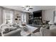 Cozy living room featuring a stone fireplace, built-in shelves, and neutral decor at 13 Westbrook Rd, Carrollton, GA 30116
