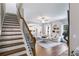 Open concept living room with hardwood floors, fireplace, and view of staircase at 13 Westbrook Rd, Carrollton, GA 30116