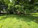 Lush backyard with mature trees, creating a serene and private outdoor space at 3692 Belmont Abbey Dr, Decatur, GA 30034
