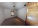 This bedroom features neutral walls, carpeted floors, a ceiling fan, and a window for natural light at 3692 Belmont Abbey Dr, Decatur, GA 30034