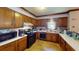 The kitchen features wooden cabinets, white countertops, and standard appliances, creating a functional cooking space at 3692 Belmont Abbey Dr, Decatur, GA 30034