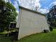 Sided exterior with screen porch, green lawn, and utilities visible at 3692 Belmont Abbey Dr, Decatur, GA 30034
