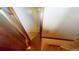 This stairway features wooden steps and trim, with neutral walls and lighting leading to a lower level at 3692 Belmont Abbey Dr, Decatur, GA 30034