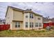 Spacious backyard with a well-maintained lawn, wood fence, grill, patio, and ample natural light at 963 Ensign Peak Ct, Lawrenceville, GA 30044