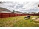 Expansive backyard featuring a full wood fence, lush grass, and patio, perfect for outdoor enjoyment at 963 Ensign Peak Ct, Lawrenceville, GA 30044