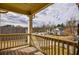 Outdoor balcony with wood floor and railing offering neighborhood views at 963 Ensign Peak Ct, Lawrenceville, GA 30044