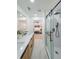 Bathroom features a double vanity, glass shower with dark hardware, and entrance to the bedroom at 2621 Gordon Se Cir, Smyrna, GA 30080