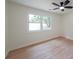 Bedroom features hardwood floors, bright natural light, and a ceiling fan at 2621 Gordon Se Cir, Smyrna, GA 30080