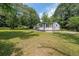Landscaped yard of a single-story home surrounded by mature trees at 2621 Gordon Se Cir, Smyrna, GA 30080
