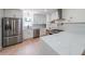Bright kitchen features stainless appliances, white cabinets, and an island with white counters at 2621 Gordon Se Cir, Smyrna, GA 30080