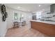 Bright kitchen features stainless appliances, white cabinets, and a dining nook with large windows at 2621 Gordon Se Cir, Smyrna, GA 30080