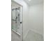 Modern bathroom shower enclosed with glass door and gray tile at 2621 Gordon Se Cir, Smyrna, GA 30080