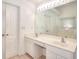 Bright bathroom featuring double sinks, vanity and a large mirror, creating a functional and elegant space at 630 Beckenham Walk Dr, Dacula, GA 30019
