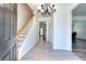 Inviting foyer featuring beautiful hardwood flooring and staircase that leads to the upper level at 630 Beckenham Walk Dr, Dacula, GA 30019
