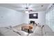 Cozy living room with inviting fireplace and plush gray sofa, perfect for relaxing or entertaining guests at 630 Beckenham Walk Dr, Dacula, GA 30019