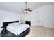 Bright main bedroom features vaulted ceiling, fan, with attached fireplace and an unusual round platform bed at 630 Beckenham Walk Dr, Dacula, GA 30019