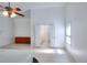 Open Primary bedroom with ceiling fan, neutral carpet, and access to the Primary bath and closet area at 630 Beckenham Walk Dr, Dacula, GA 30019