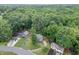 Aerial view of a home nestled among lush trees and greenery at 859 Sangria Ct, Lawrenceville, GA 30043