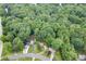Aerial view of a home nestled among lush trees and greenery at 859 Sangria Ct, Lawrenceville, GA 30043