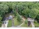 Aerial view of a home nestled among lush trees and greenery at 859 Sangria Ct, Lawrenceville, GA 30043