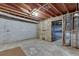 Exposed basement construction featuring block foundation, insulation, and wooden framing at 859 Sangria Ct, Lawrenceville, GA 30043