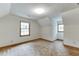 An empty bedroom with two windows provides natural light at 859 Sangria Ct, Lawrenceville, GA 30043